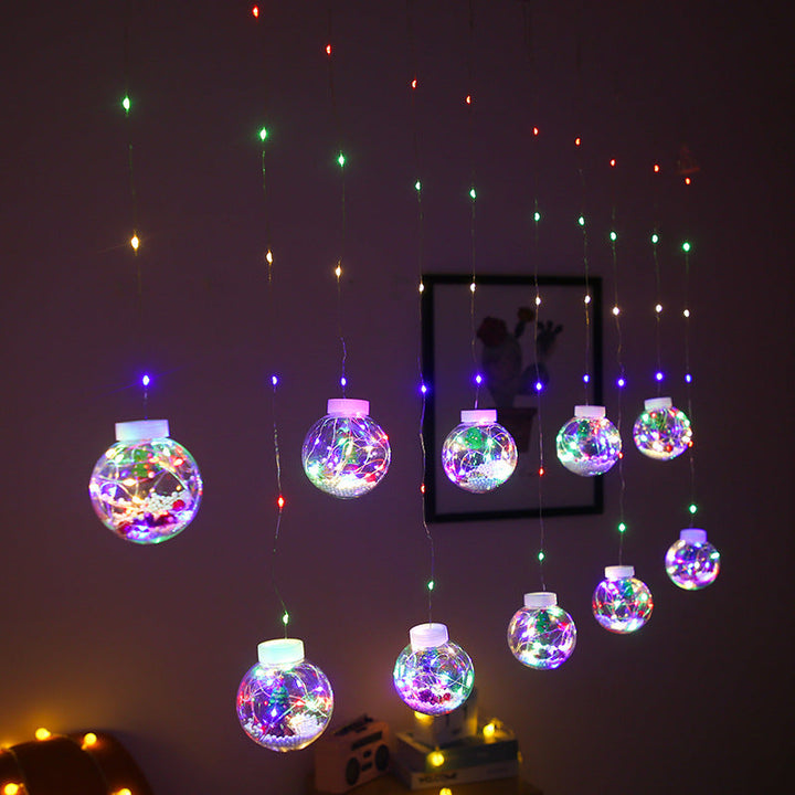 Curtain light with baubles and Christmas figures