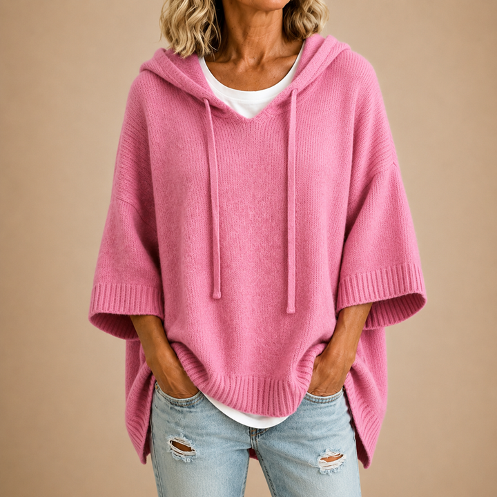 Knitted hooded poncho with three-quarter sleeves