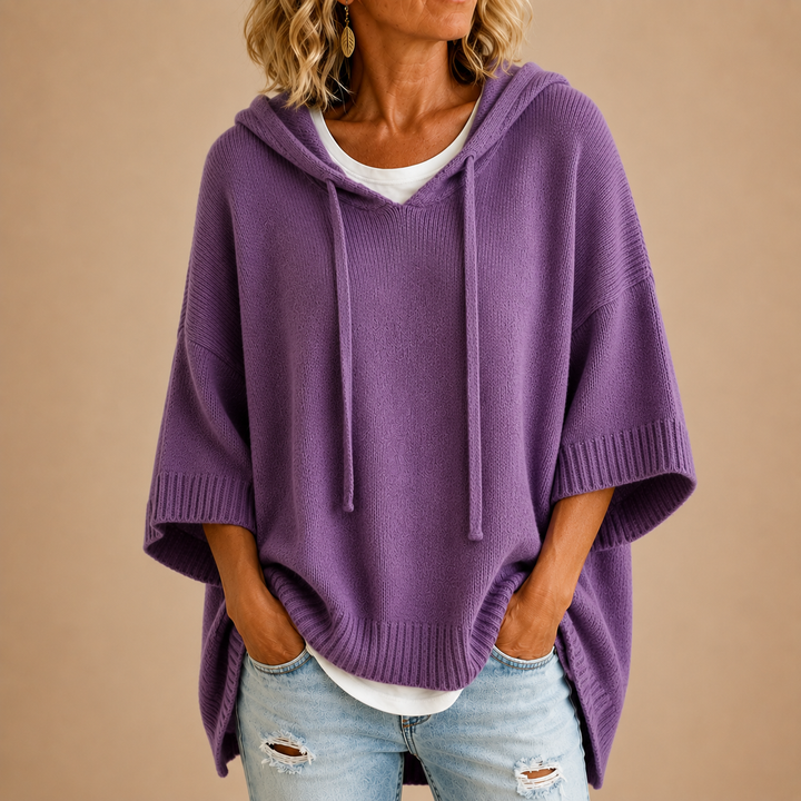 Knitted hooded poncho with three-quarter sleeves