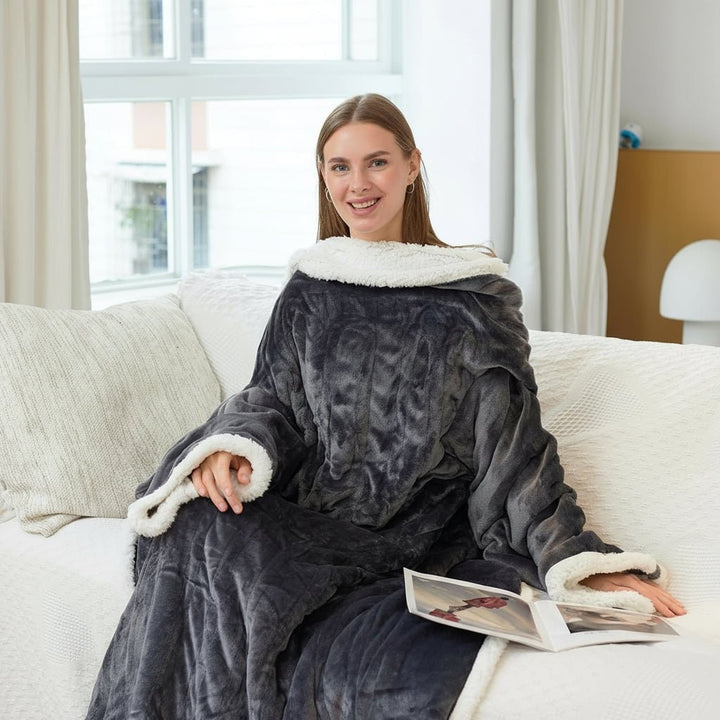 Heated wearable blanket with sleeves and foot pocket in sherpa fleece