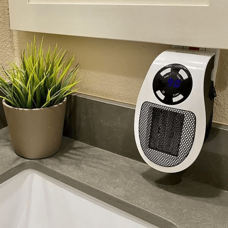 Portable 500 W heater with 15–32 °C thermostat