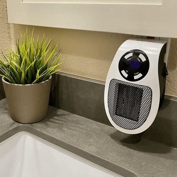 Portable 500 W heater with 15–32 °C thermostat